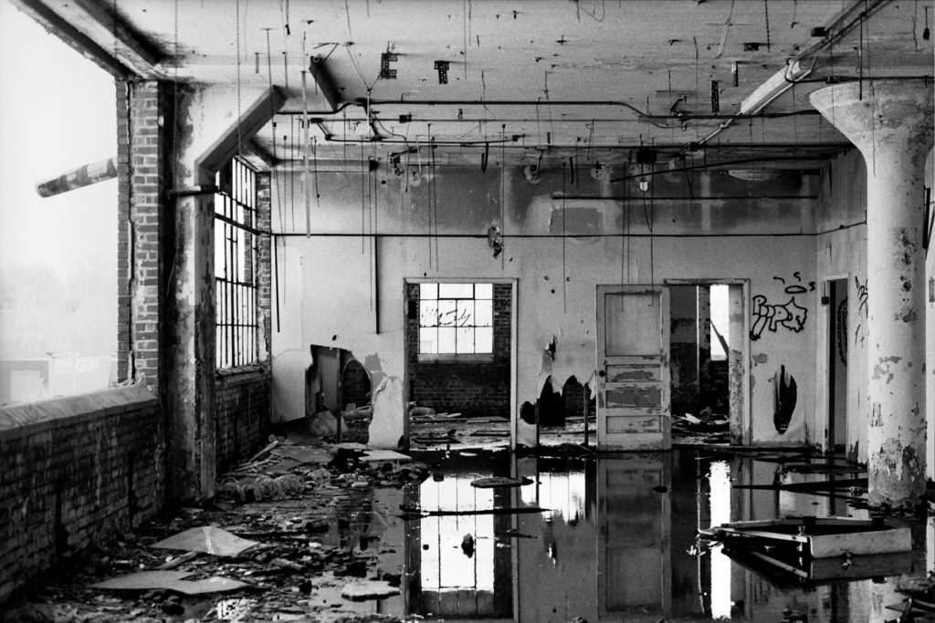 reflections in water inside abandoned victoreen factory in cleveland ohio