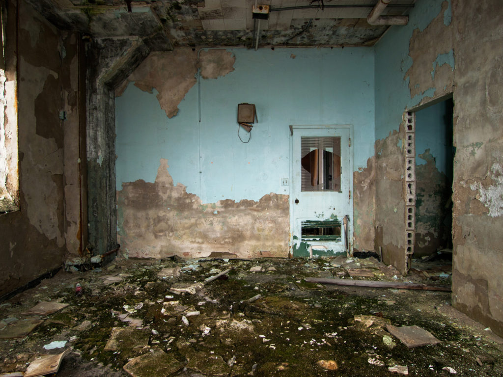 Abandoned victoreen factory in cleveland ohio blue peeling paint
