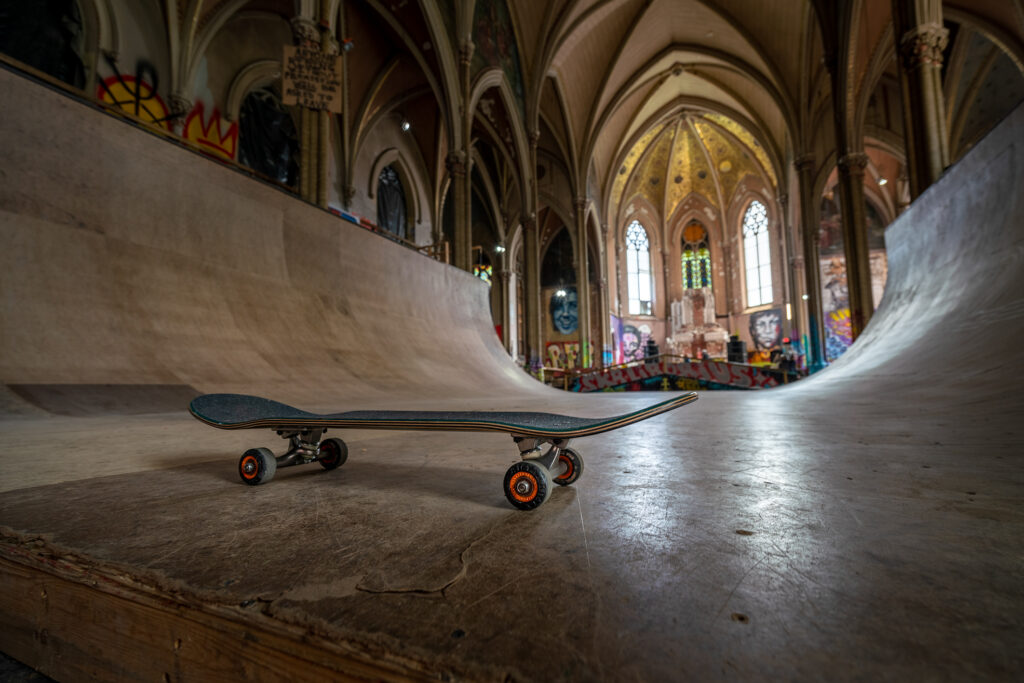 A skateboard sits on a halfpipe in the former church