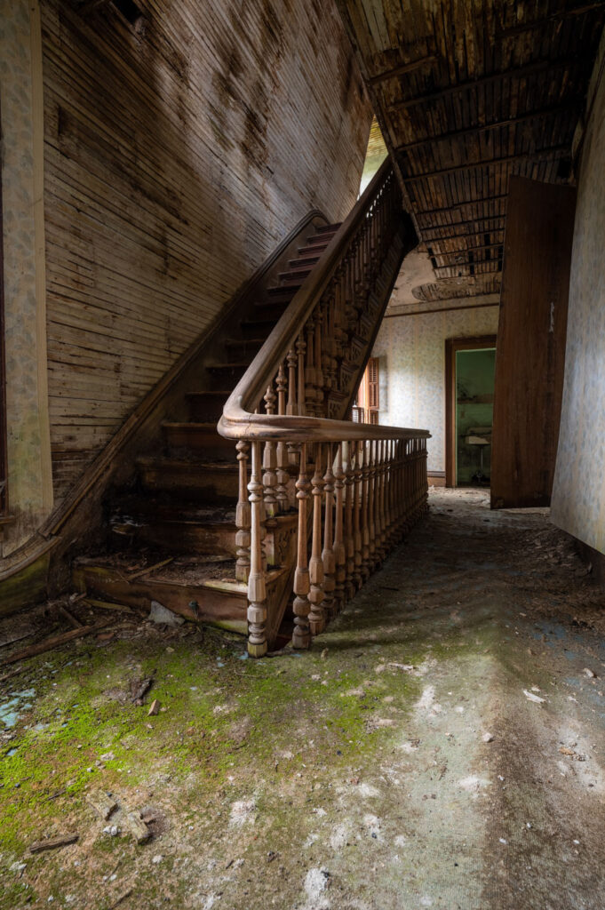 stairwell inside abandoned victorian home